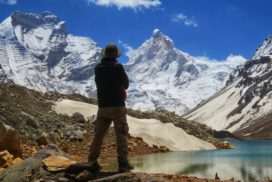 A trekker watching Thalayasagar peak from Kedartal lake shore