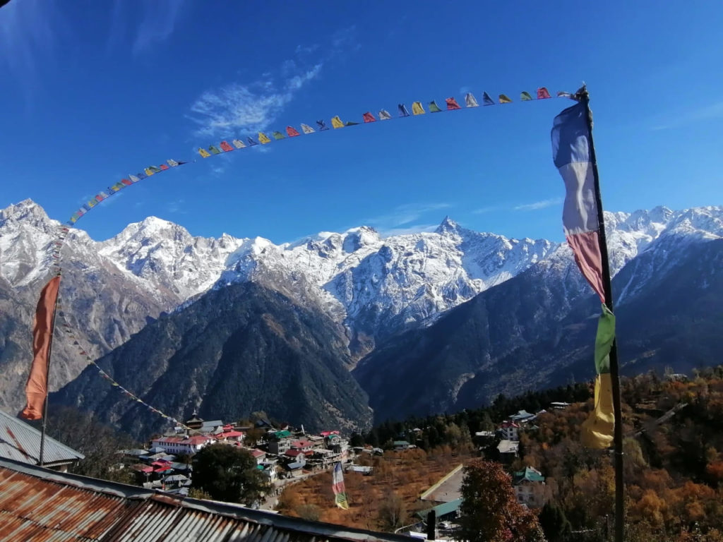 Buddhist prayer flags fluttering in sunny autumn day in Kalpa